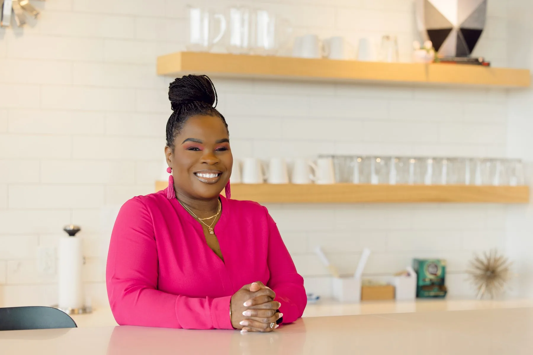 Latisha Newby leaning on a counter.