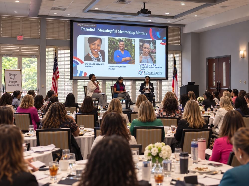 A panel session in a full banquet room at a SHRM Raleigh Metro event.